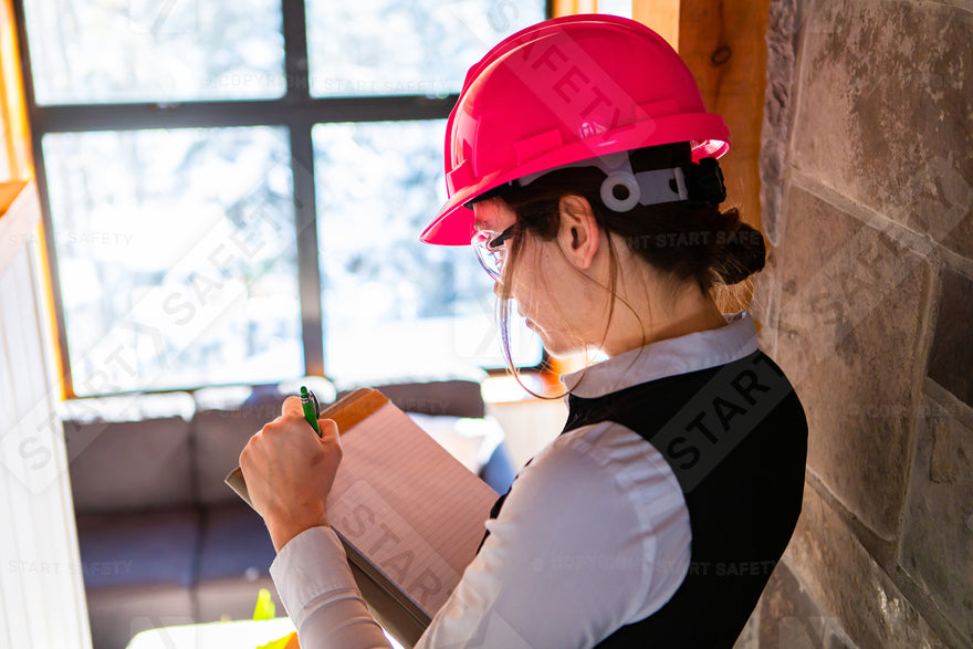 Building Inspector Wearing A Pink Hard Hat