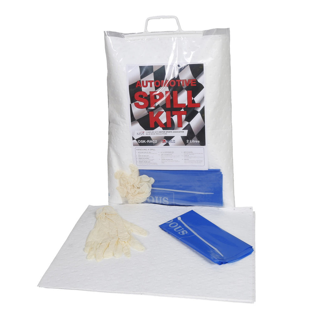 Automotive spill kit with gloves, absorbent pads, and a bag on a white background