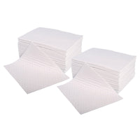 Multiple white absorbent pads on a white background