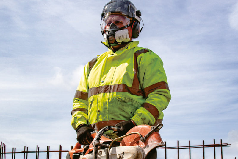 Worker Cutting Concrete