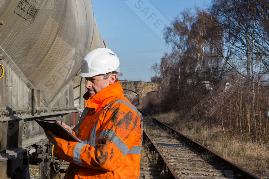 Railway Worker Wearing Orange Hi Vis Workwear