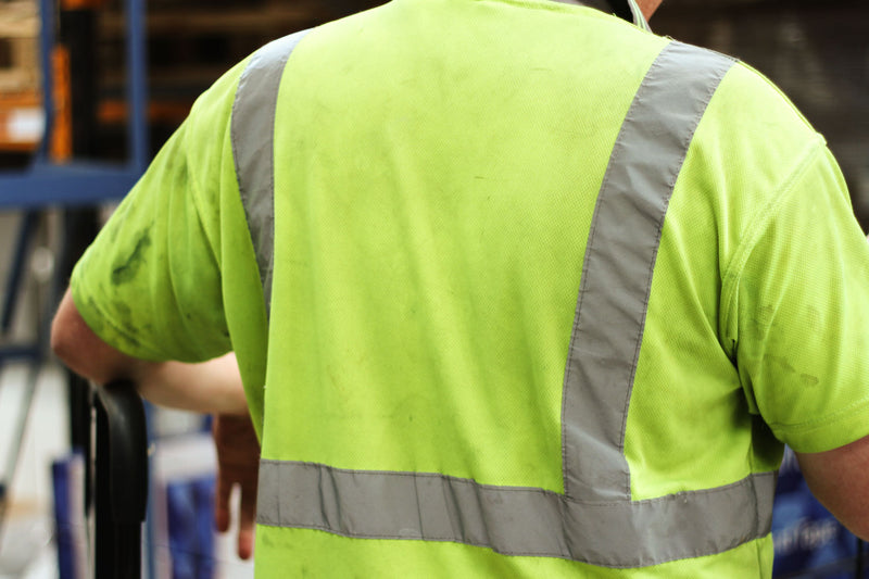 Dirty Hi-vis Polo Shirt Worn By A Scruffy Warehouse Worker