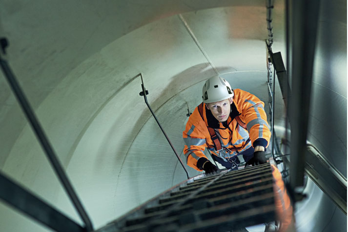 White JSP EVO Alta Skyworker Helmet In Use By Worker Climbing Tall Ladders