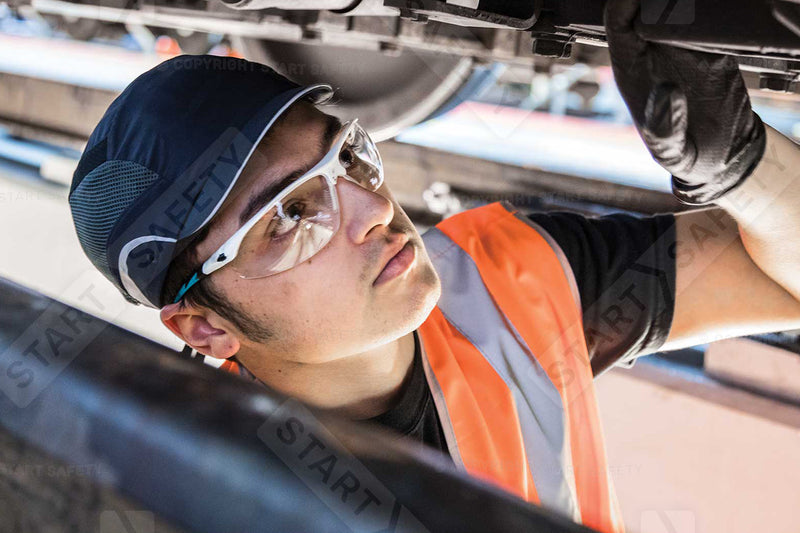 Mechanic Wearing A Bump Cap And Eye Protection