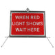 When Red Light Shows Wait Here dia. 7011 - Roll Up Sign / RA1 | 1050x750mm