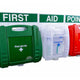 Wall-mounted first aid kits at a first aid point