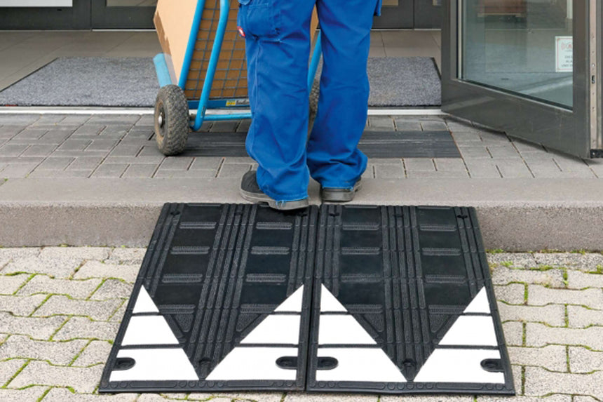 Extra Long Kerb Ramp In Use With Delivery Driver