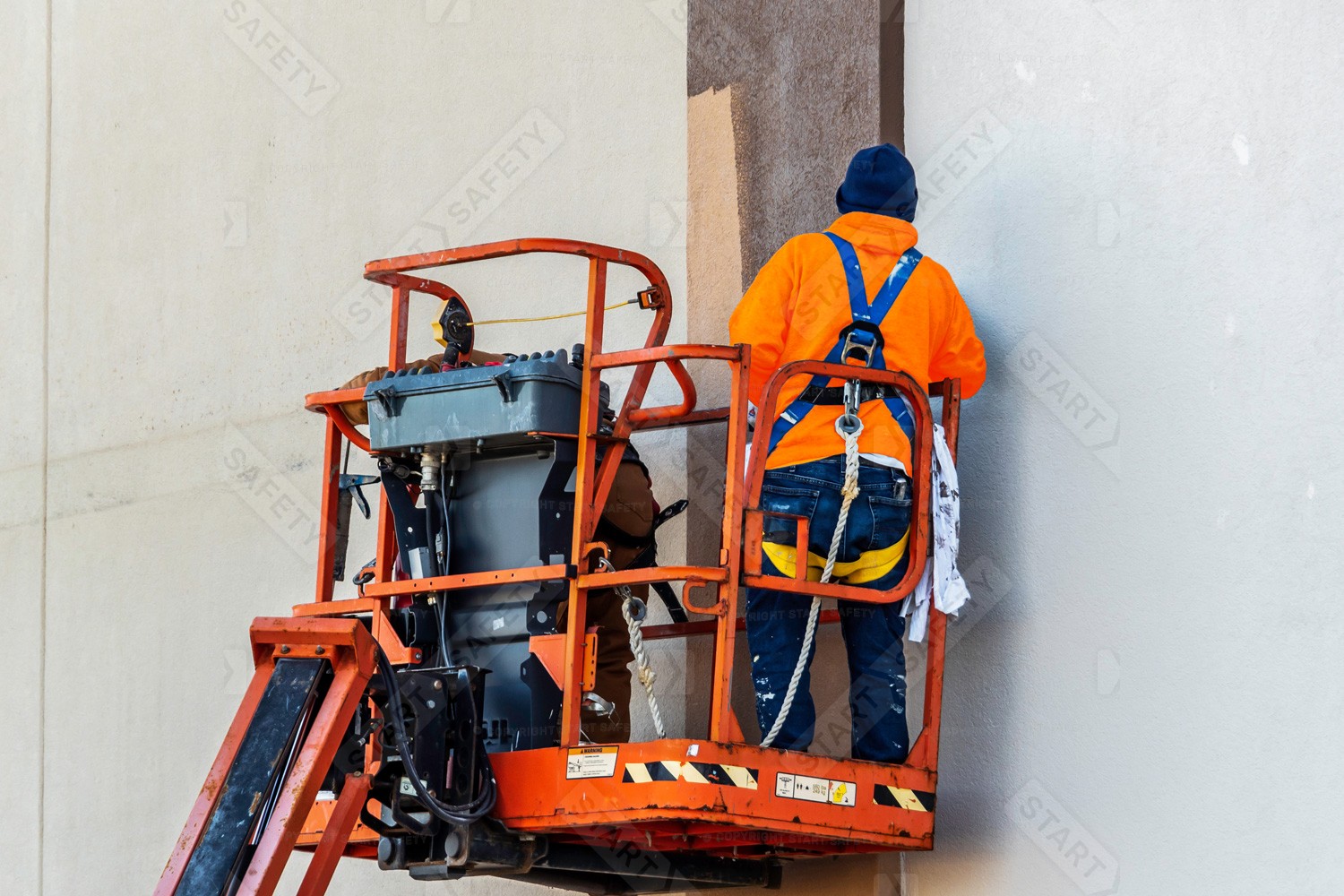 Civil Engineer Wearing A Harness While Working In A Cherry Picker