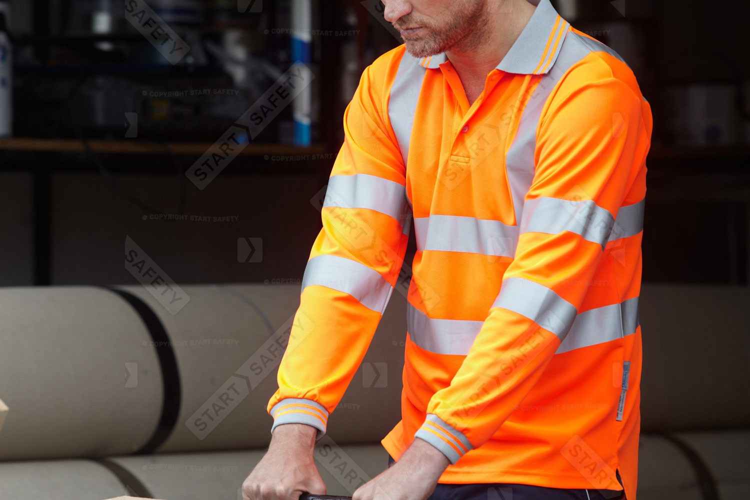 Worker Wearing An Orange Hi Vis Polo Shirt From Pulsar