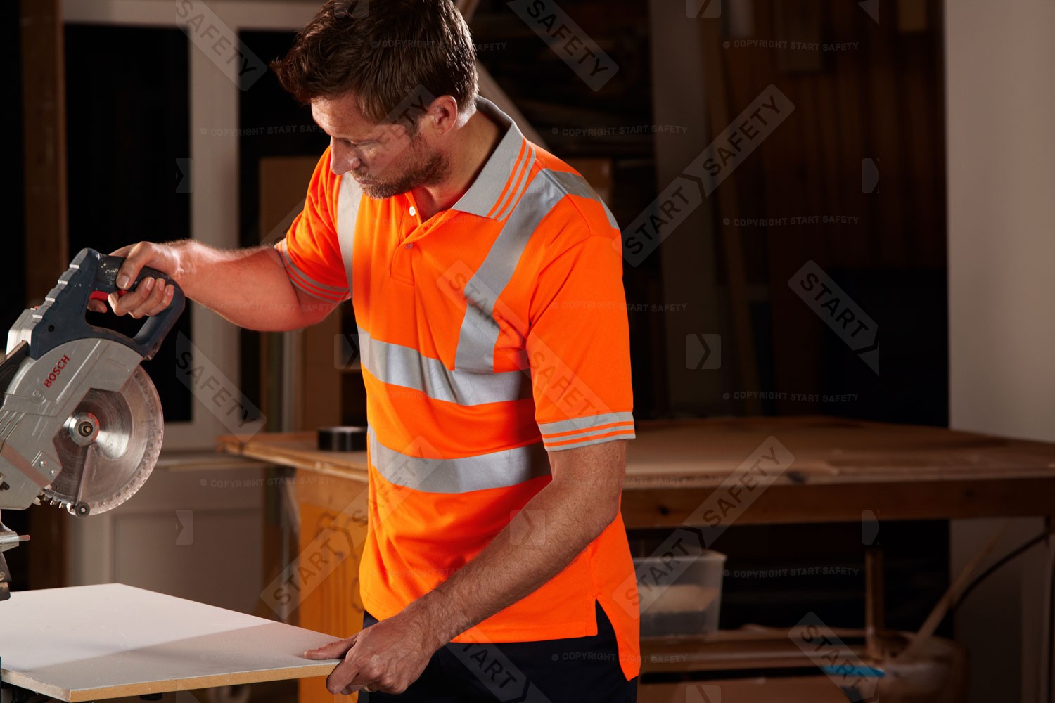 Worker Wearing A Pulsar PR175 Orange Hi Vis Polo Shirt