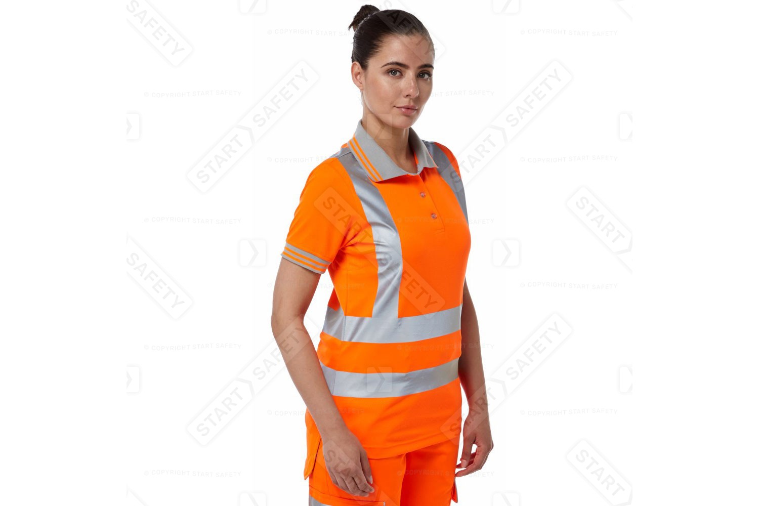 Woman Wearing A Pulsar P701 Short Sleeved Orange Hi Vis Polo Shirt