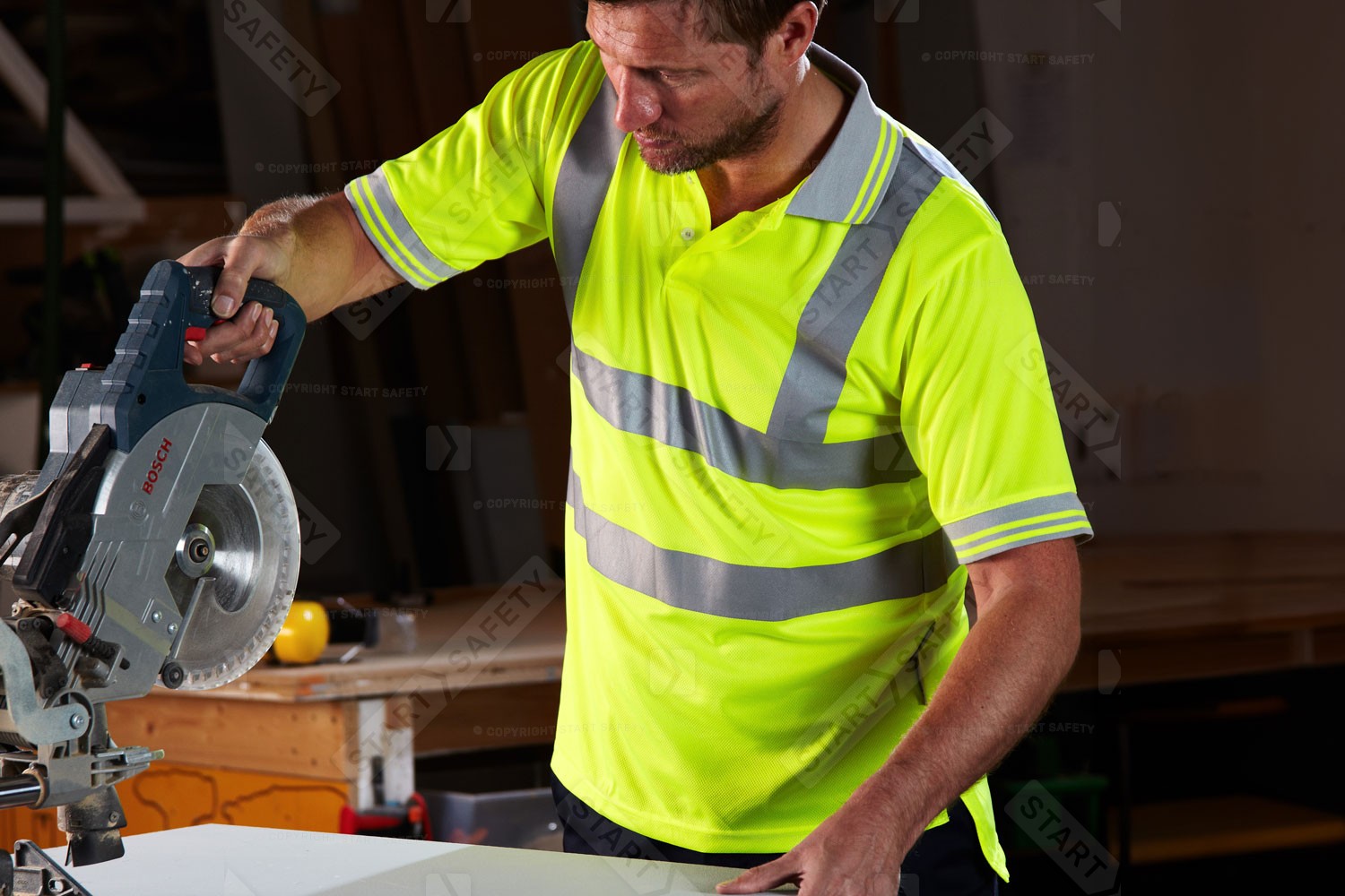 Worker Wearing P175 Hi Vis Polo Shirt While Sawing