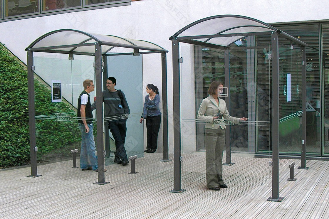 Procity Voute Smoking Shelters in Use With Side Wind Protectors Installed