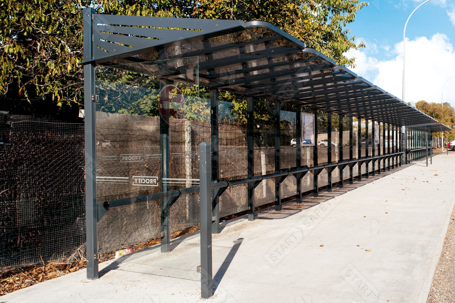 Procity Conviviale Bus Shelter Installed With Side Cladding and Perch Bench