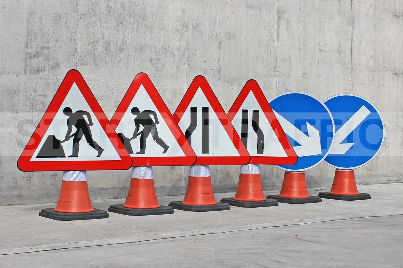 Cone Signs Set Against A Concrete Wall