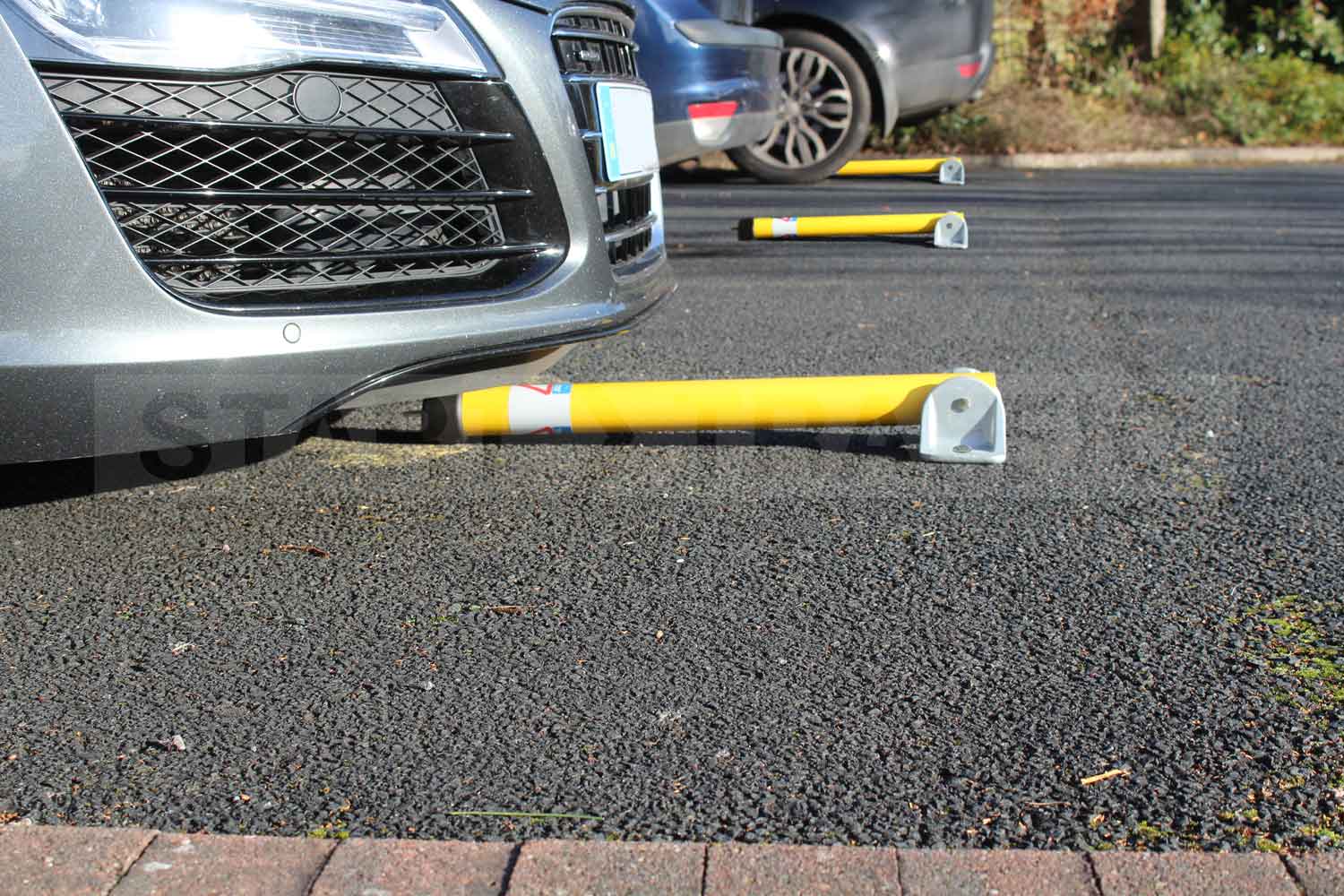 Hinged Parking posts reserving private spaces