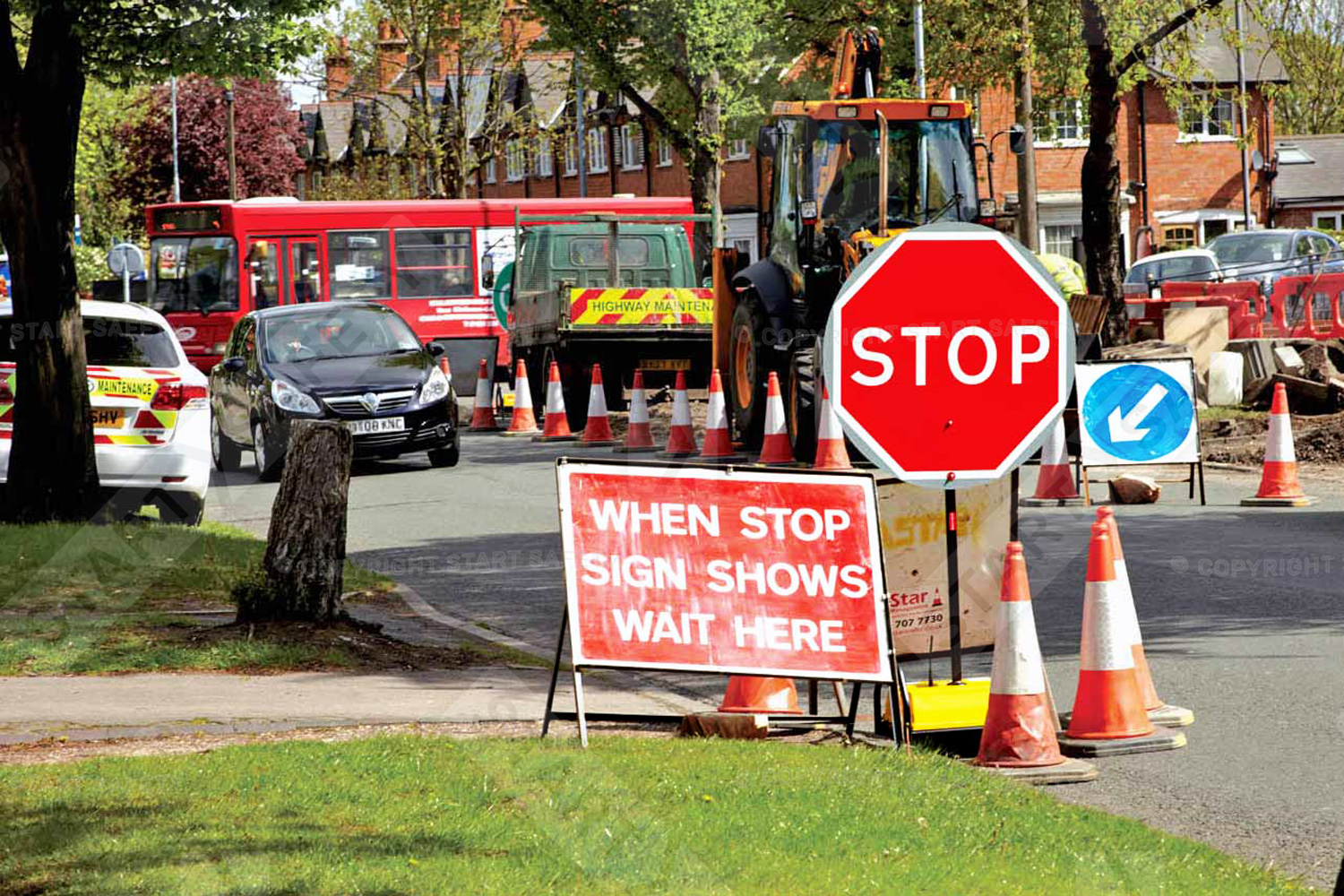 Robosign in use with traffic cones and stanchion signage