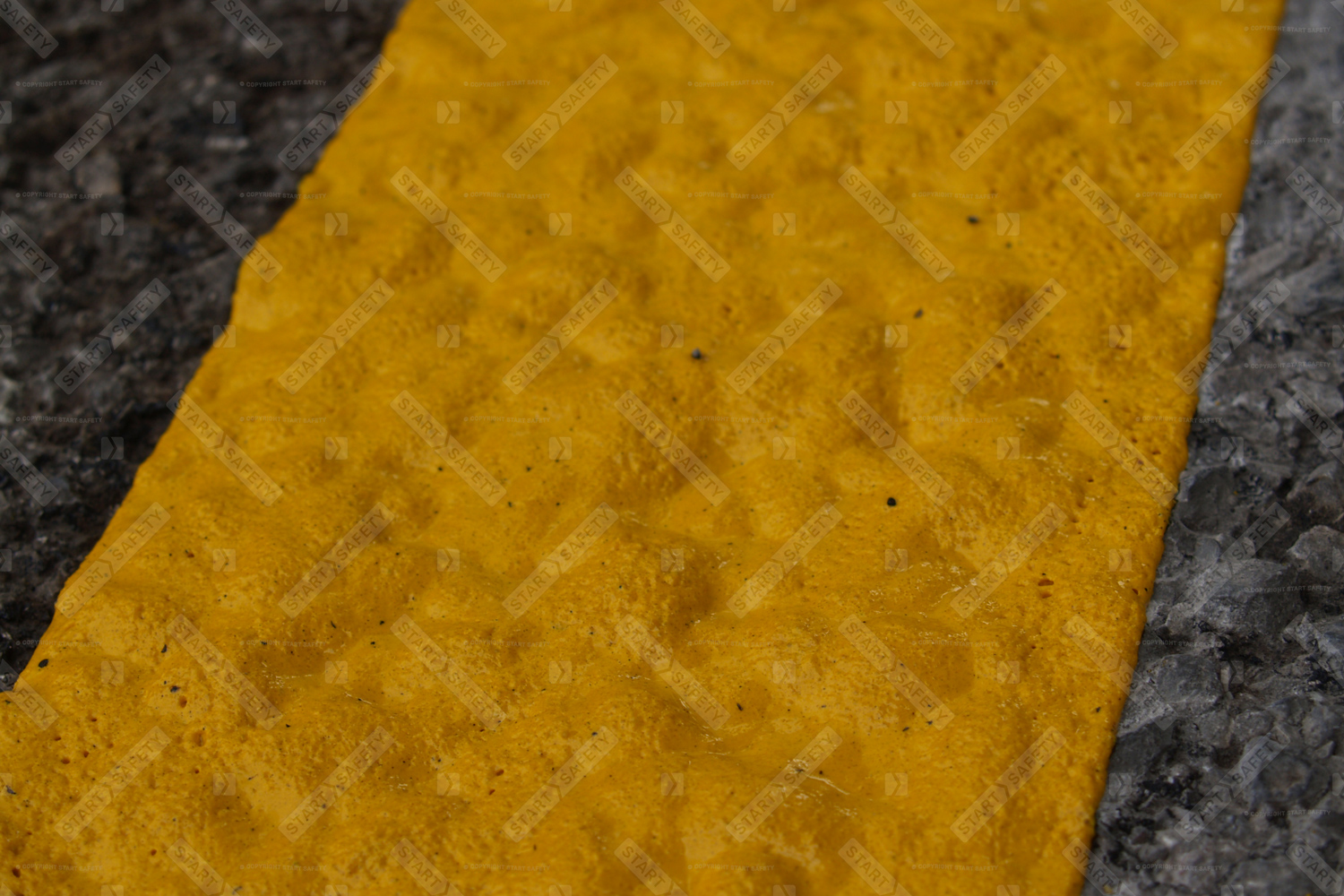 Yellow thermoplastic applied to concrete
