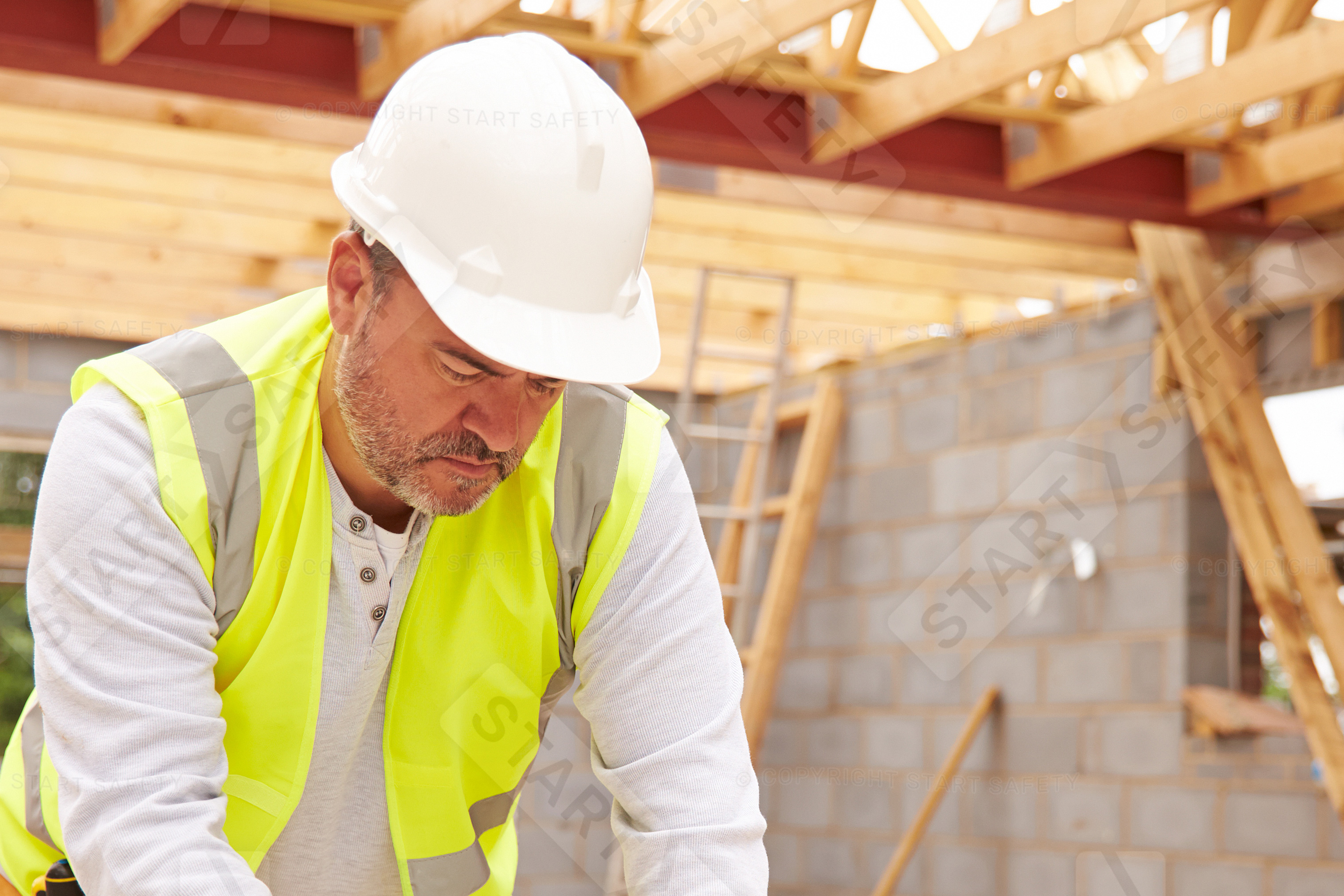 Construction Worker Wearing A White Hard Hat