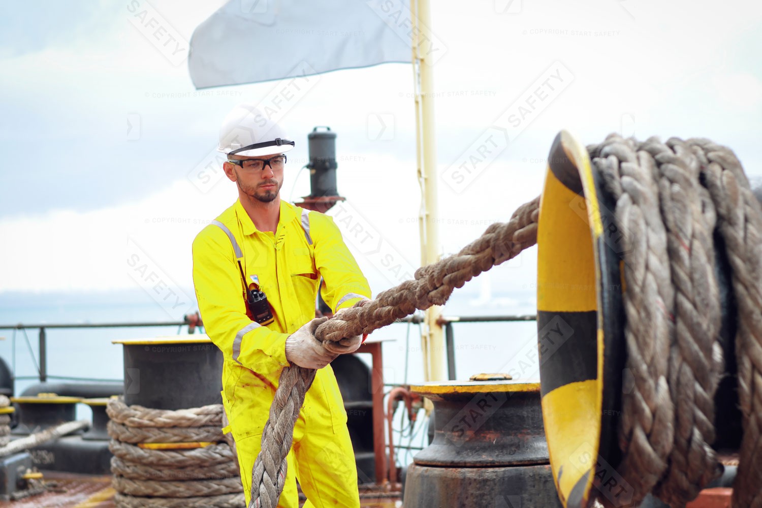 Marine Worker Wearing A Hi Vis Yellow Overalls