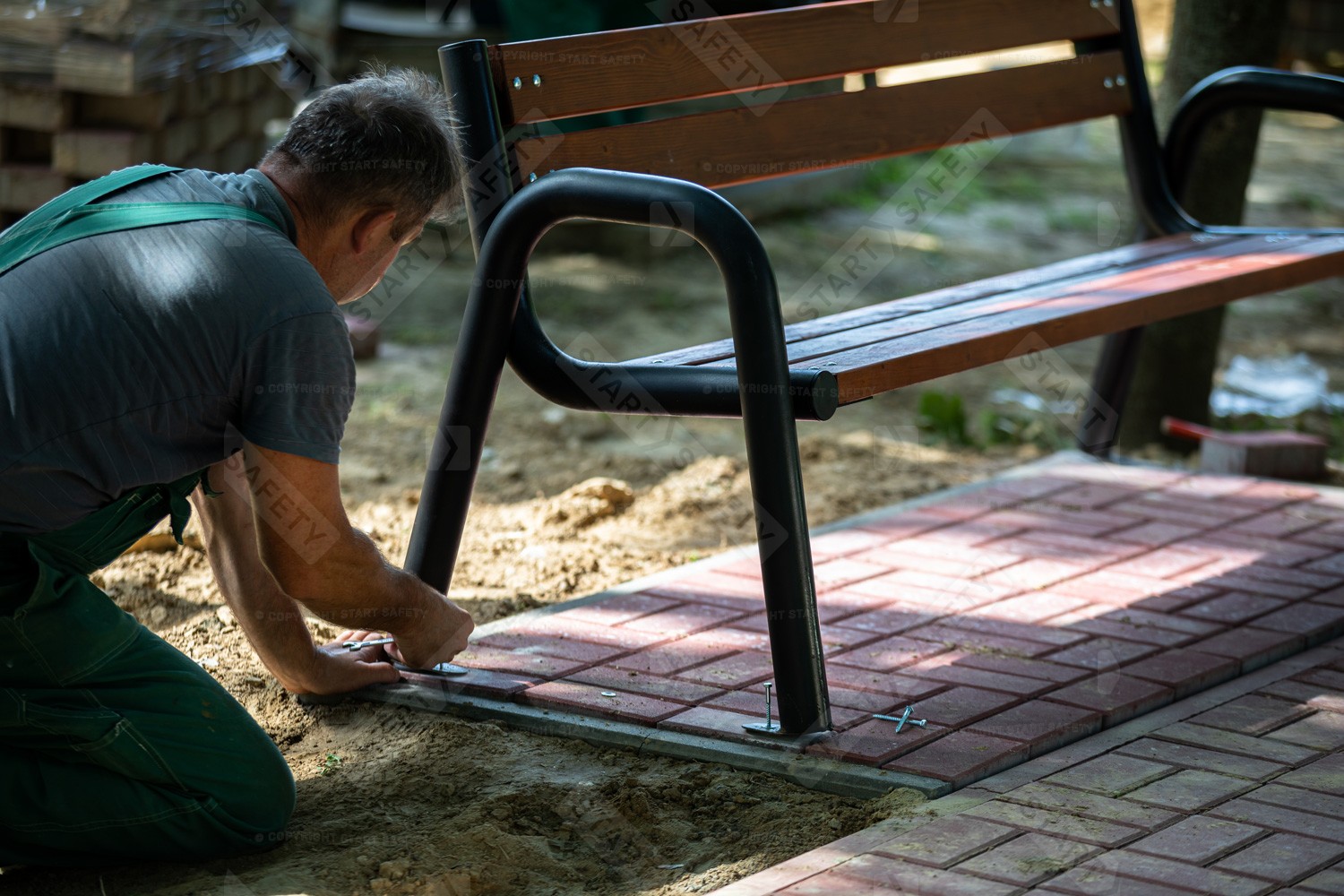 Seat Bench With a Backrest Being Installed In Park Bolted Into The Floor