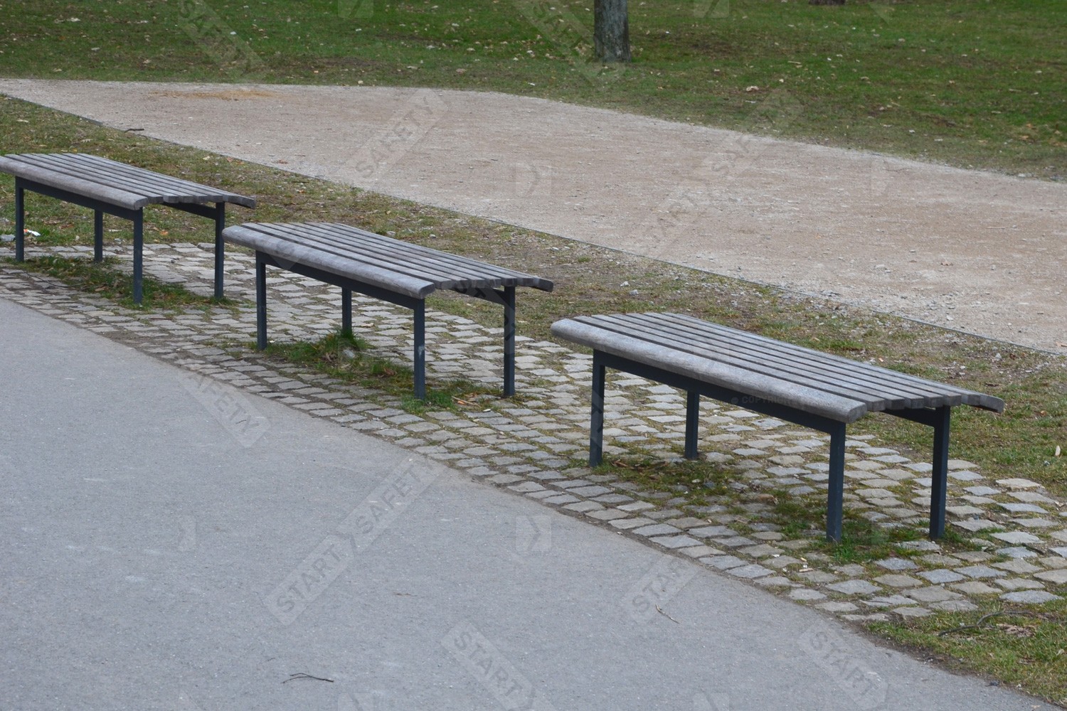 Wood and Steel Backless Benches In a Line