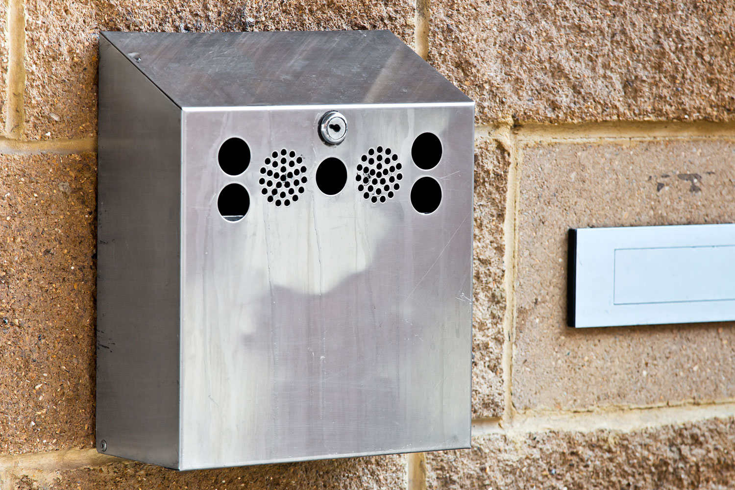 Wall Mounted Cigarette Bin To Save Space