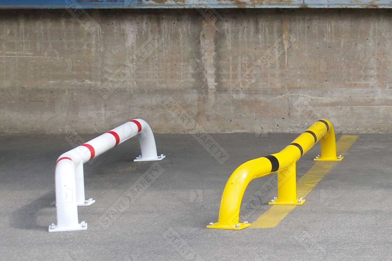 Contrasting White & Yellow Black Bull HGV Wheel Guides Installed By A Loading Bay