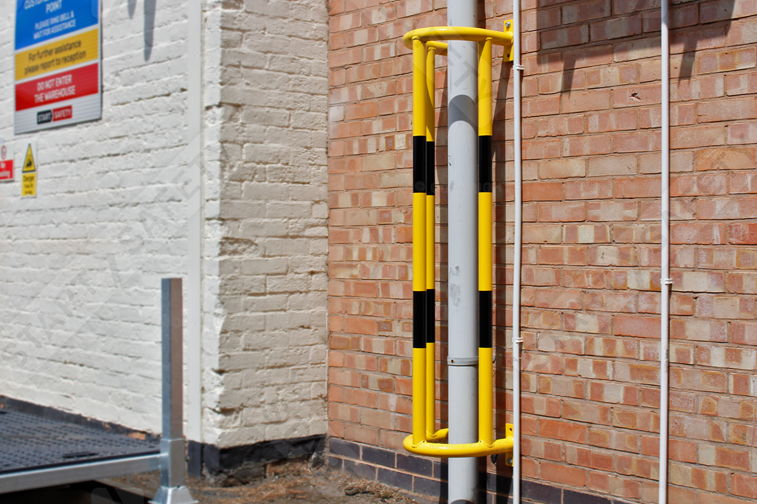 Wall Mounted Pipe Protector Fitted Outside Warehouse