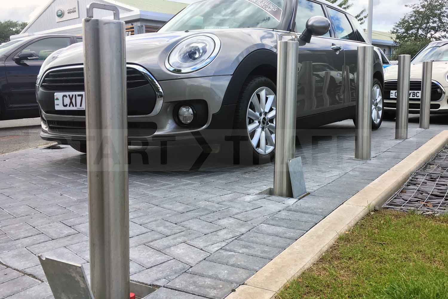 retractable Stainless Parking Post installed at a car showroom