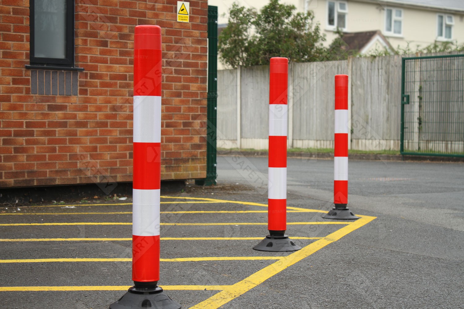 Highly Visible Red & White Traffic-Line Off Highway Posts Installed On A Car Park