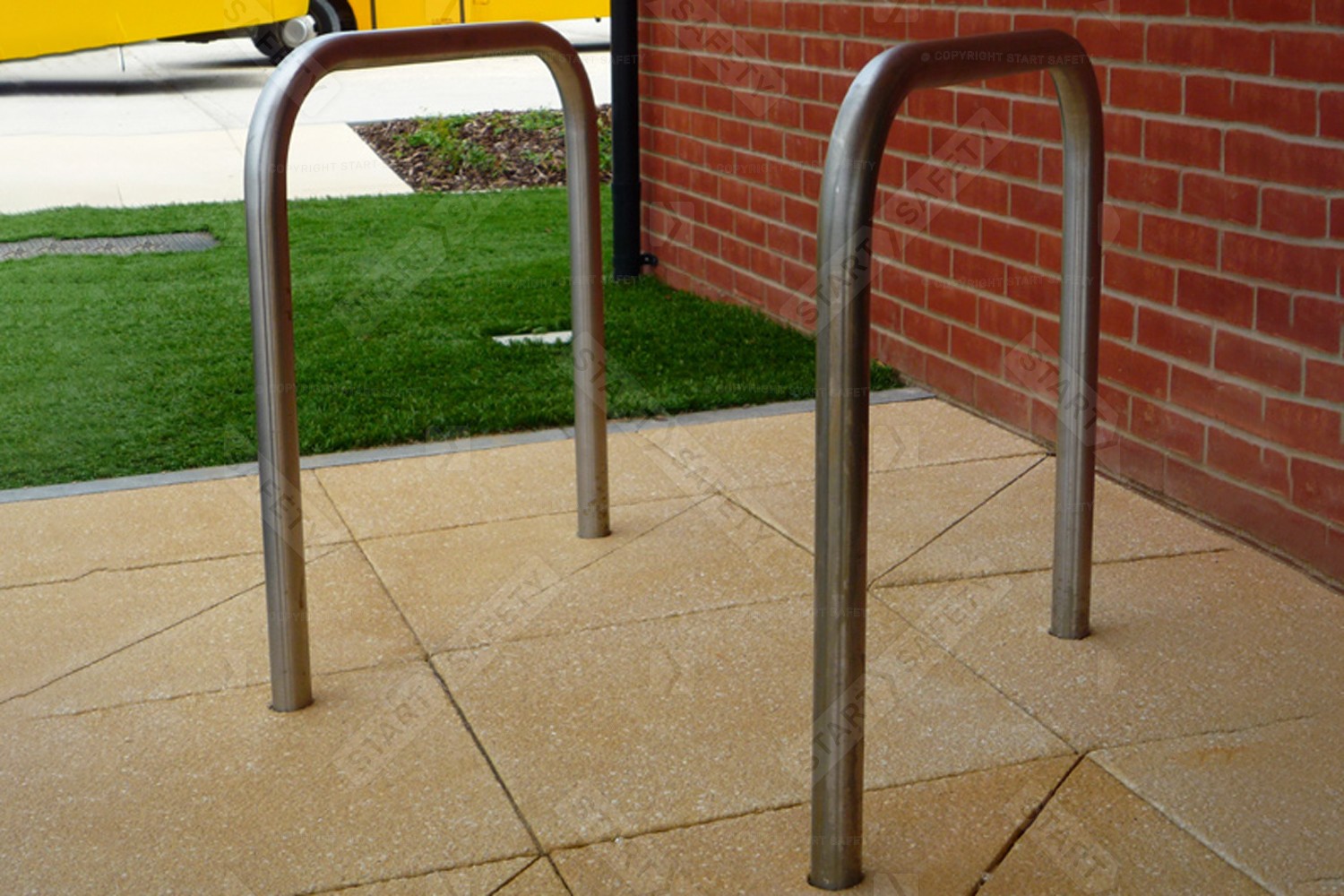 Premium stainless steel Sheffield cycle stand installed into paving