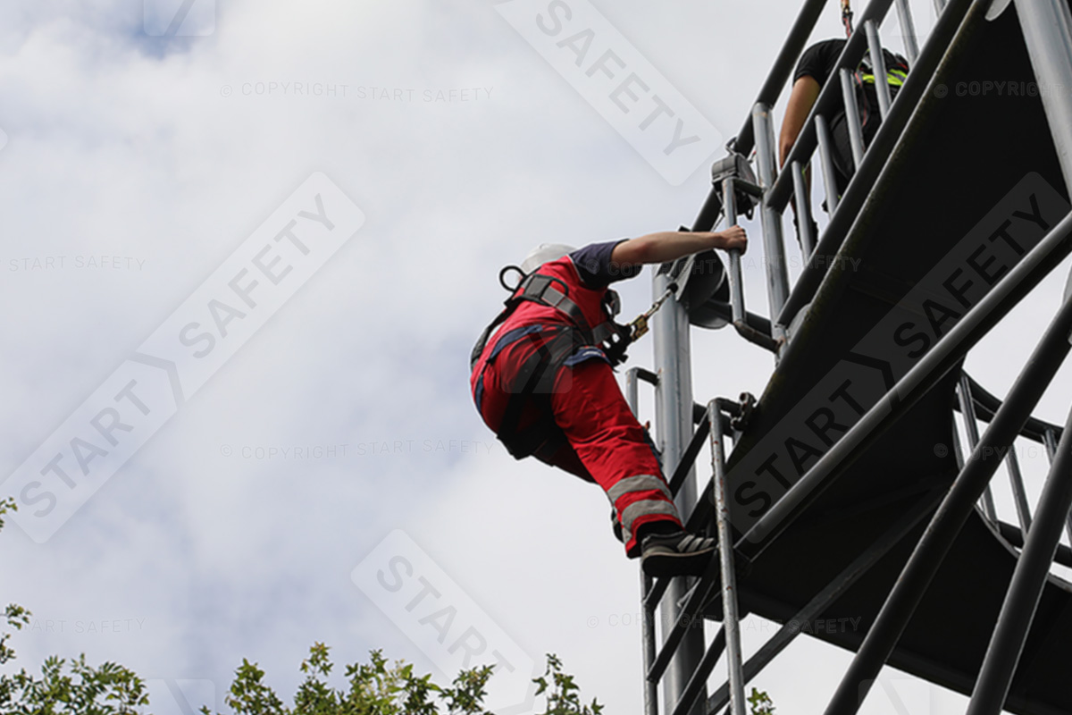Worker Climbing A Tower While Wearing A K2 5-point Harness