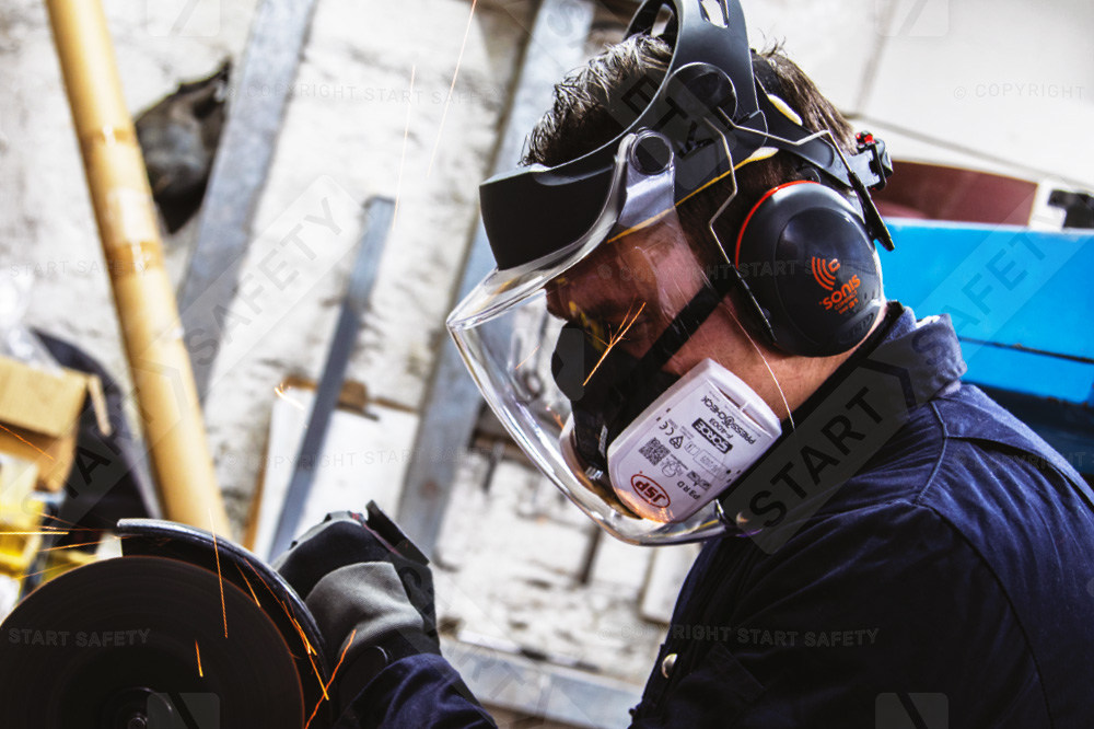 Worker Grinding While Wearing A JSP Force8 Half Mask And JSP C4 Max Clear Visor