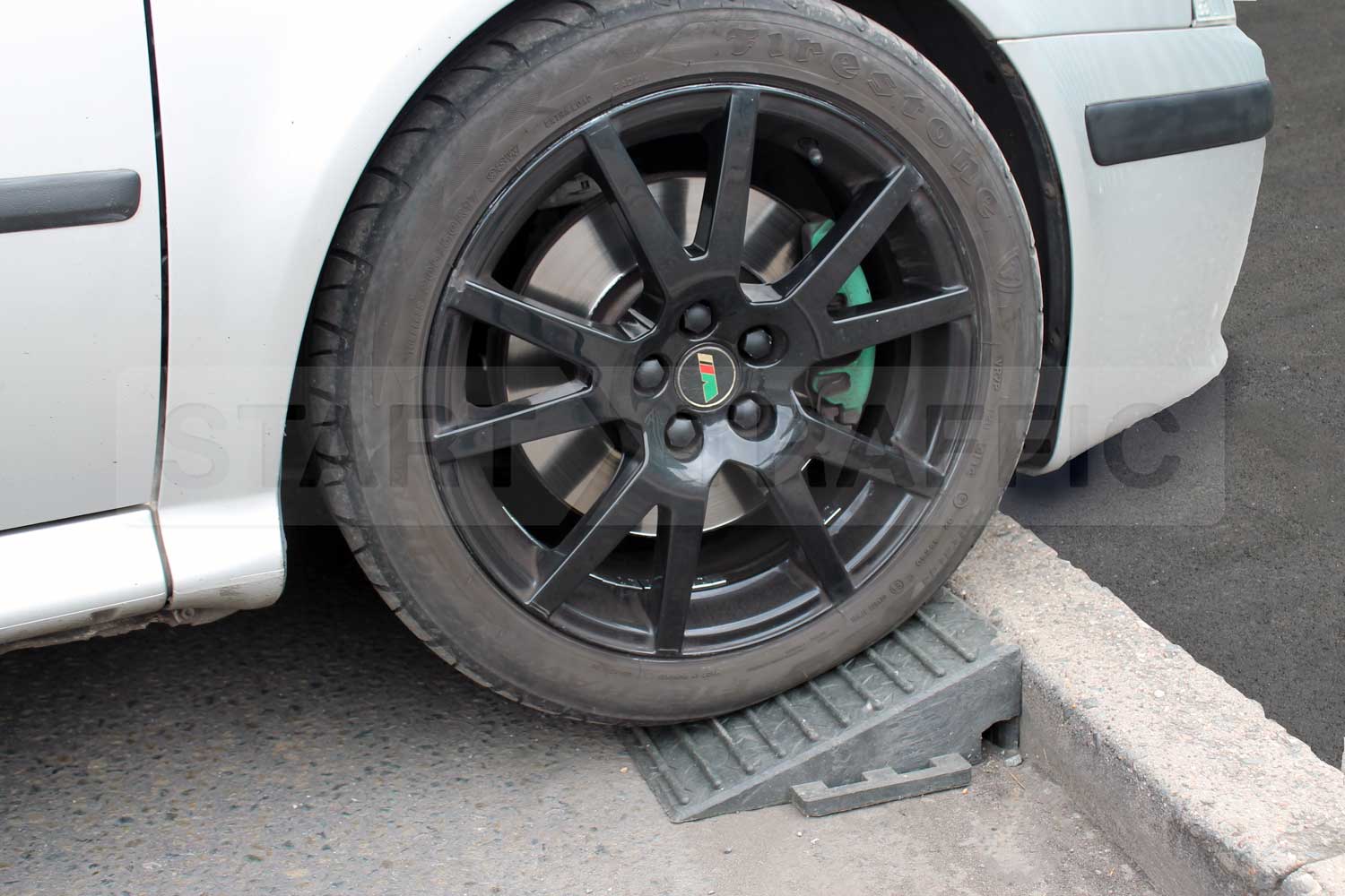Kerb Wedge being used with car