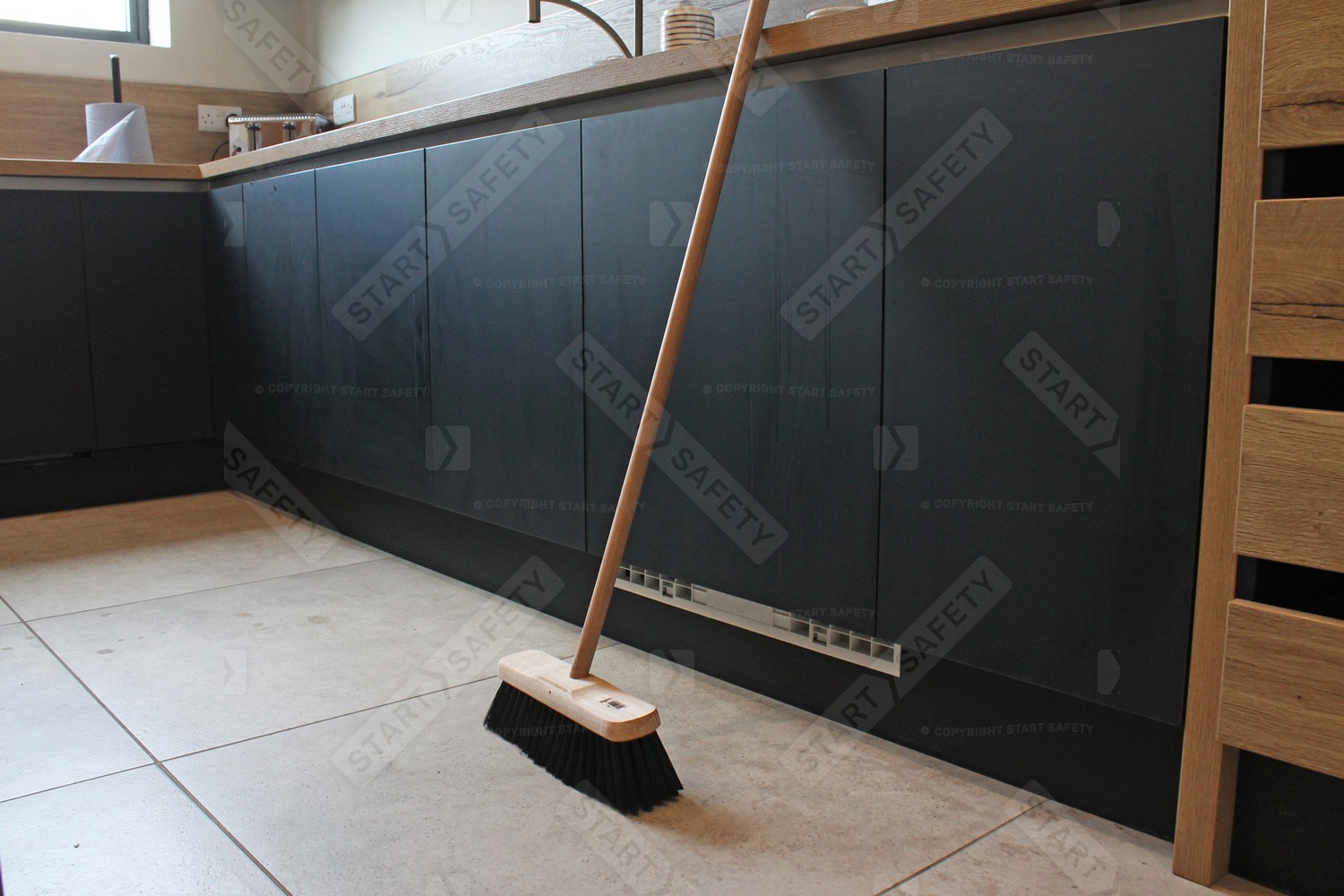 Domestic Sweeping Broom In Kitchen