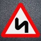 Double Bend Red Triangle Road Marking - Thermoplastic Symbol Dia. 513