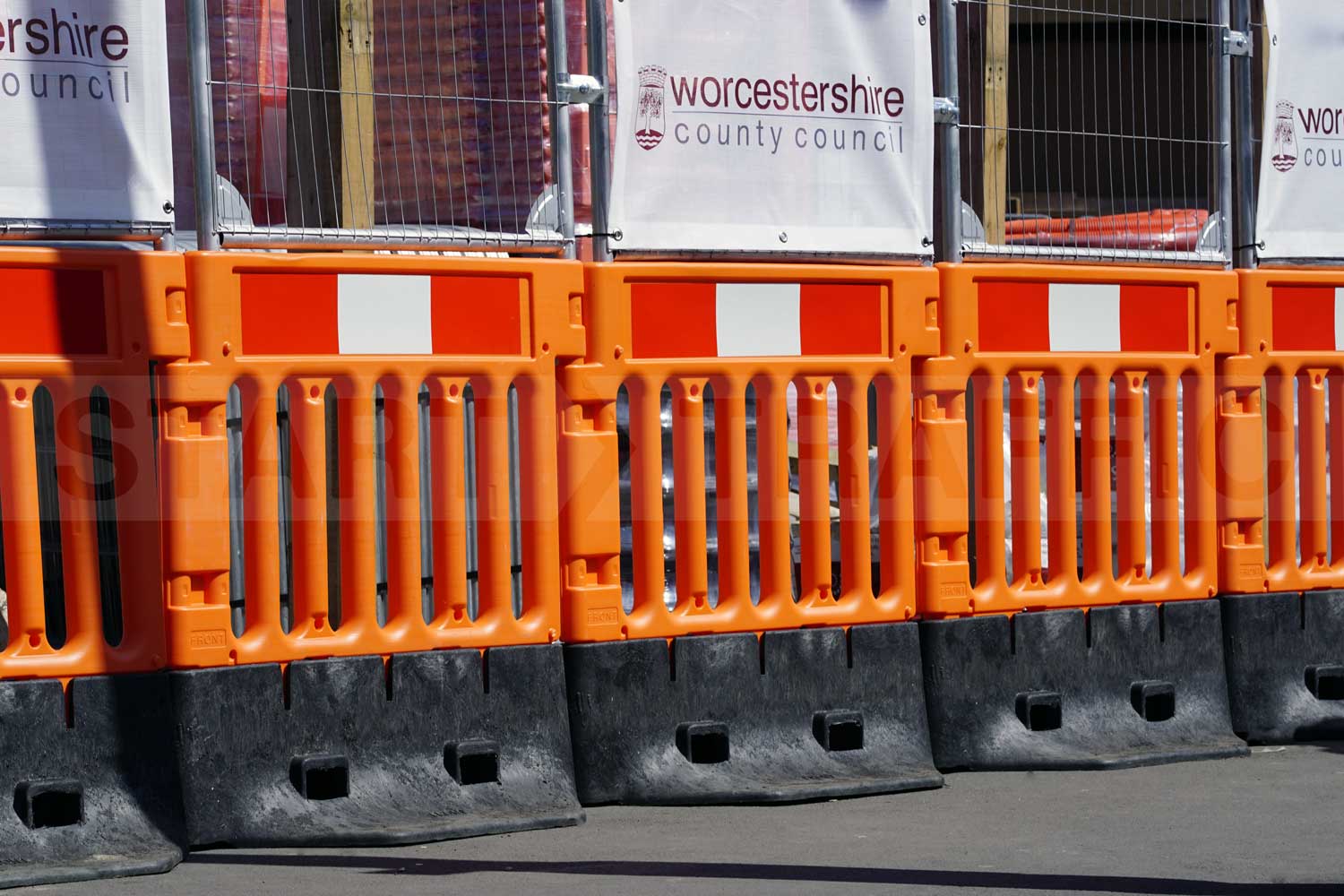StrongWall Barriers with Fence tops protecting pedestrians from the worksite