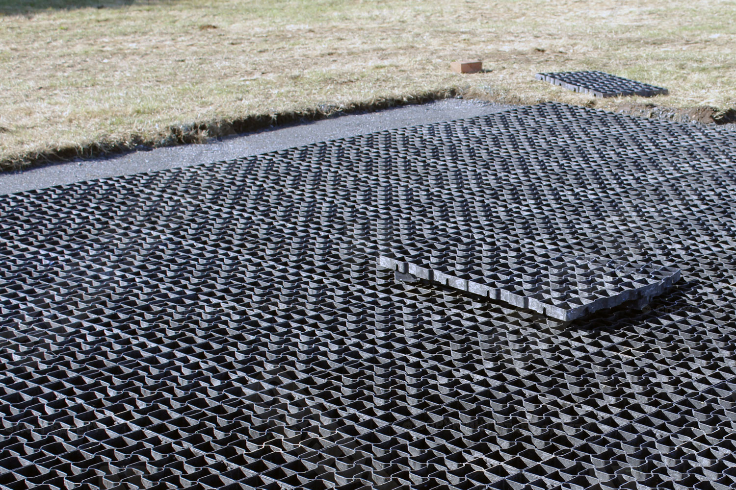 Geogrid plastic gravel grids being installed
