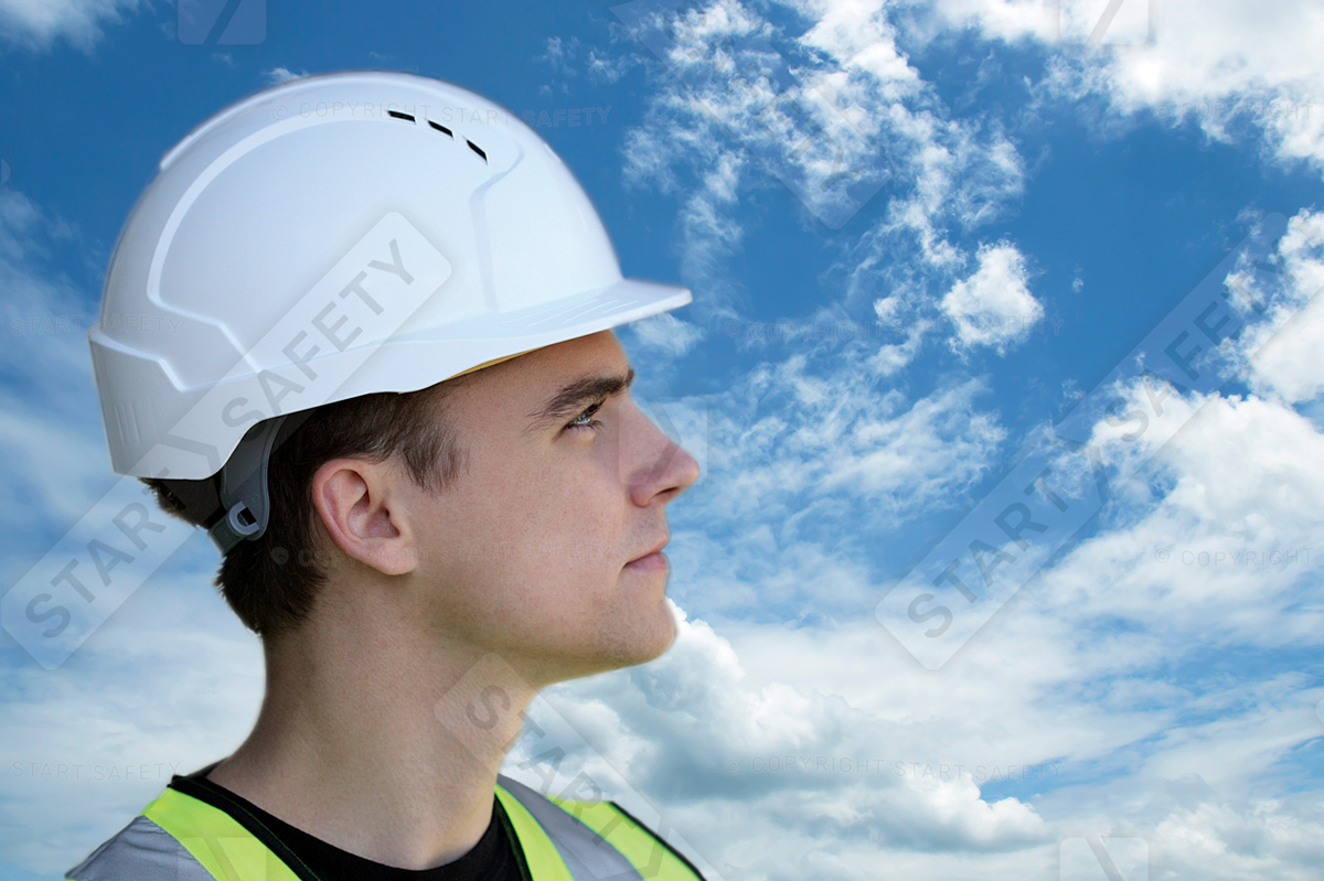 Man Wearing A White Lightweight Evolite Safety Helmet Staring At The Sky