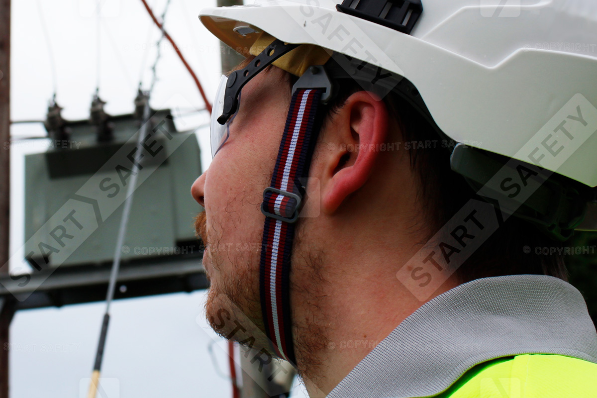 Man Working On Ground Wearing A EN397 Compliant 2-point Chin Strap